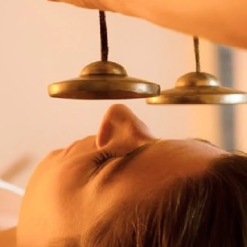 A women receiving Vibrational Sound therapy